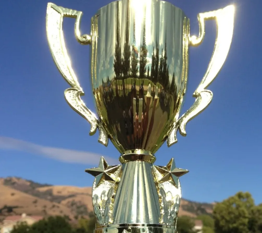 Trophy with celebration elements representing team victories and fan rewards