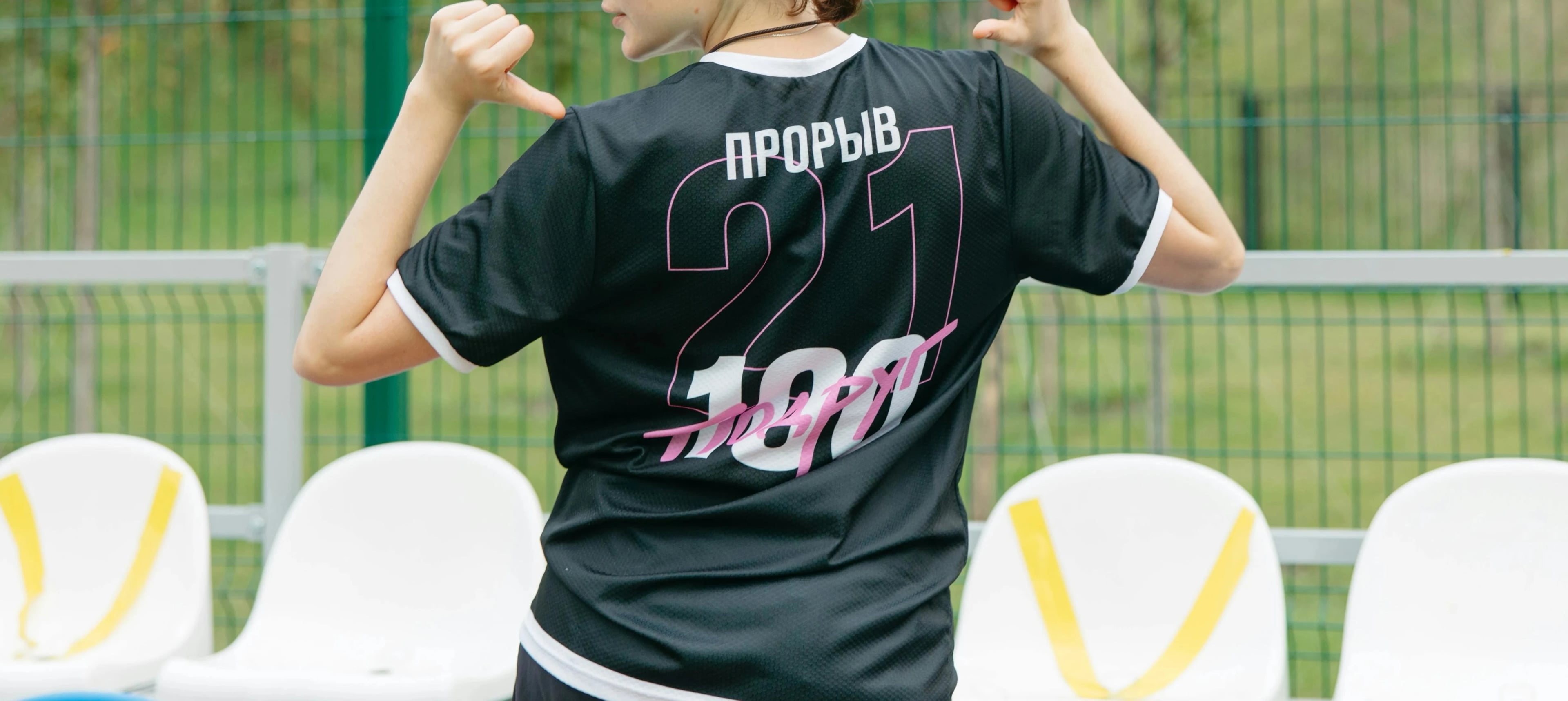 Football stadium with team jerseys and sponsorship branding display